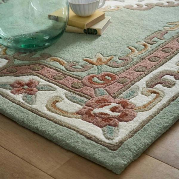 Decorative rug with floral patterns on a wooden floor