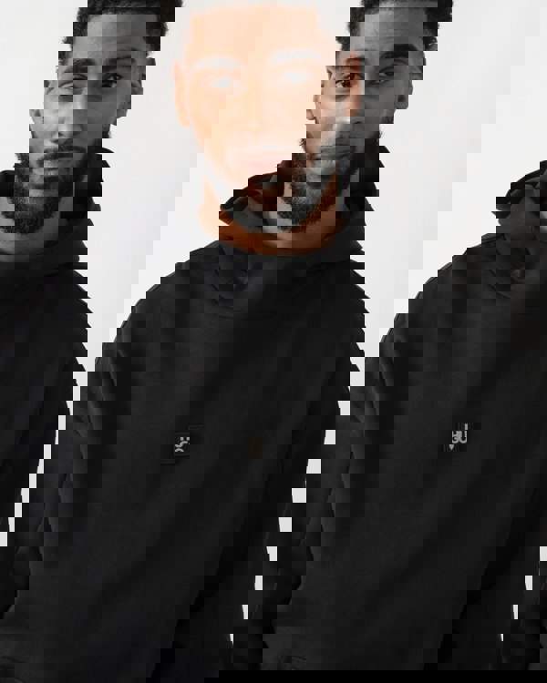 detail shot of a model wearing a HUGO Danovohood Mens Hoodie in Black