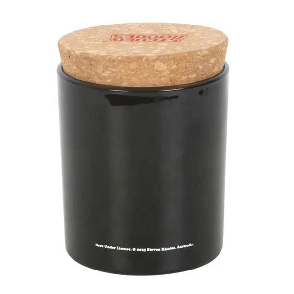 Black candle jar with cork lid, bottom text visible
