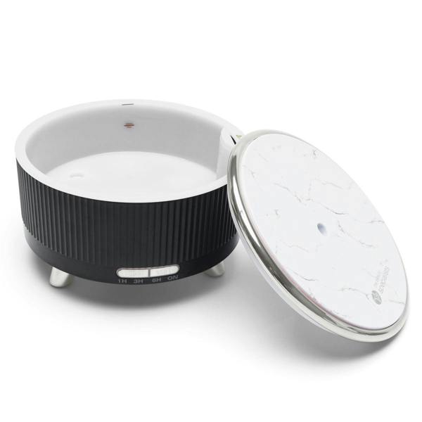 The SONAS Aroma Diffuser, Humidifier & Night-Light by Rio is a round black and white unit with a marble-patterned lid, small legs, timer control switch, and provides humidifying moisture ideal for aromatherapy oils.