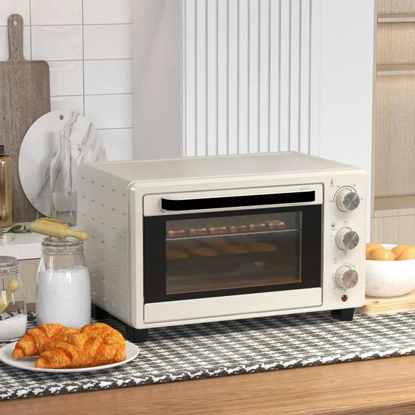 Cream mini countertop oven with glass door and right-side control knobs