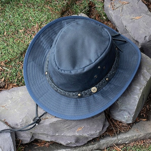 The wilderness navy waxed cotton unisex hat by Wombat