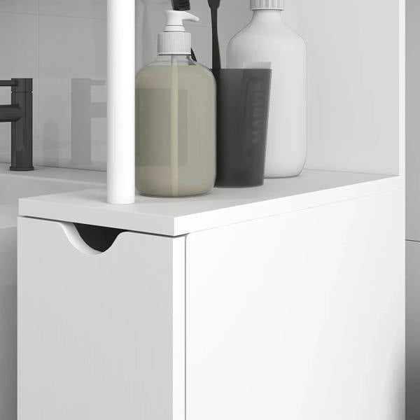 White cabinet top shelf with countertop bottles and a drawer front with curved handle.