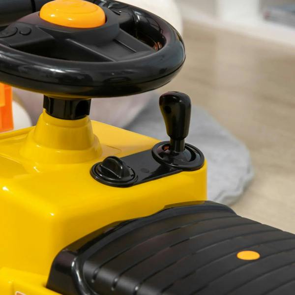 Close-up of yellow kids ride-on forklift truck seat and black steering wheel handle