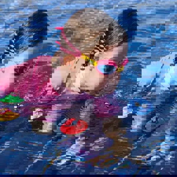 Cute pink Zoggs Seal Flips swim cap with yellow and blue accents for kids