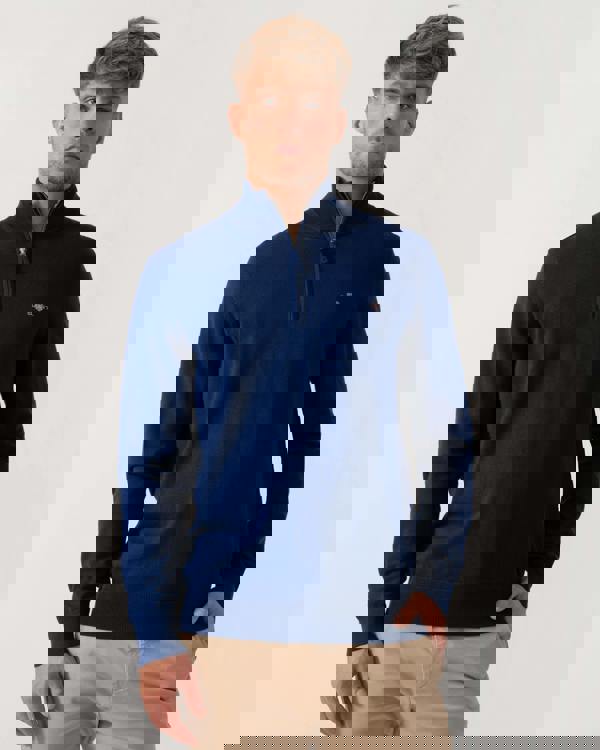 Model wearing GANT Mens Classic Cotton Half Zip Jumper in 432 Rich Navy - Main