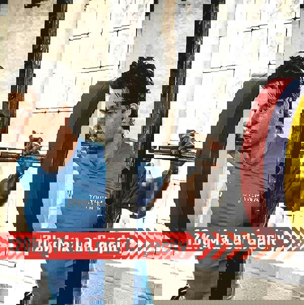 Body Revolution 1.2m EZ Barbell Bar with Spinlock Collars, featuring a sturdy design and vibrant weight plates, ideal for strength training