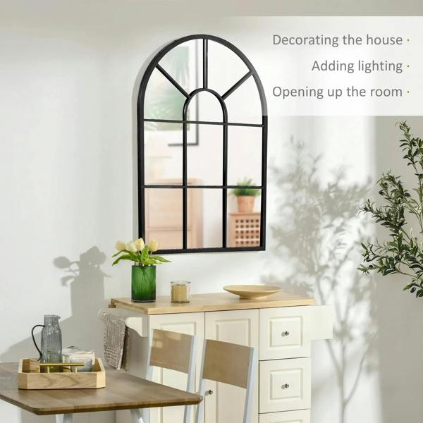 Arched grid mirror with black frame and window-like grid for room-wide reflection.