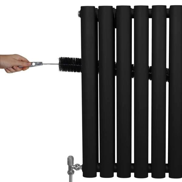 Black oval column radiator with sleek, matte finish, showcasing valves and a hand adjusting the connection, 1800mm x 600mm