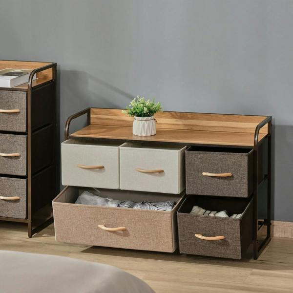 Wood top dresser with five linen fabric drawers; front drawers open with folded linens inside