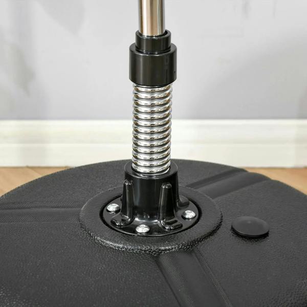 Close-up of black round base and spring post for punching bag stand
