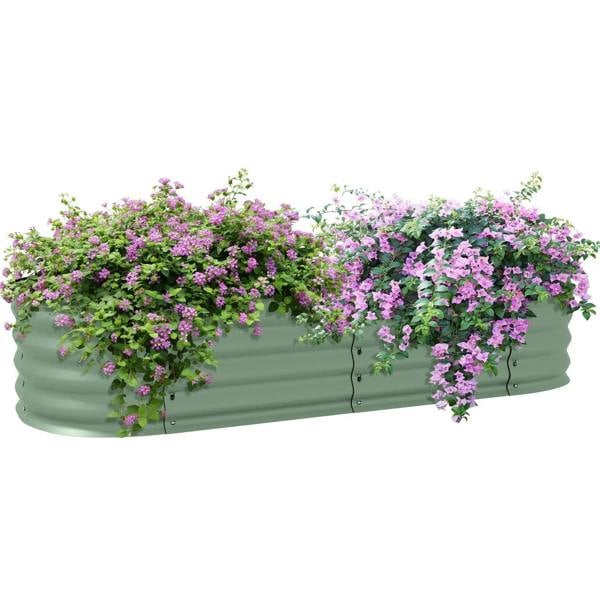 Green metal raised garden bed with safety edging, filled with blooming flowers