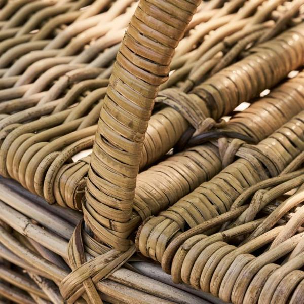 Sturdy fixed rattan handle and lid hinge detail on a picnic basket.