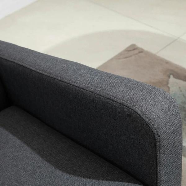 Charcoal grey upholstered armrest edge with padded cushion