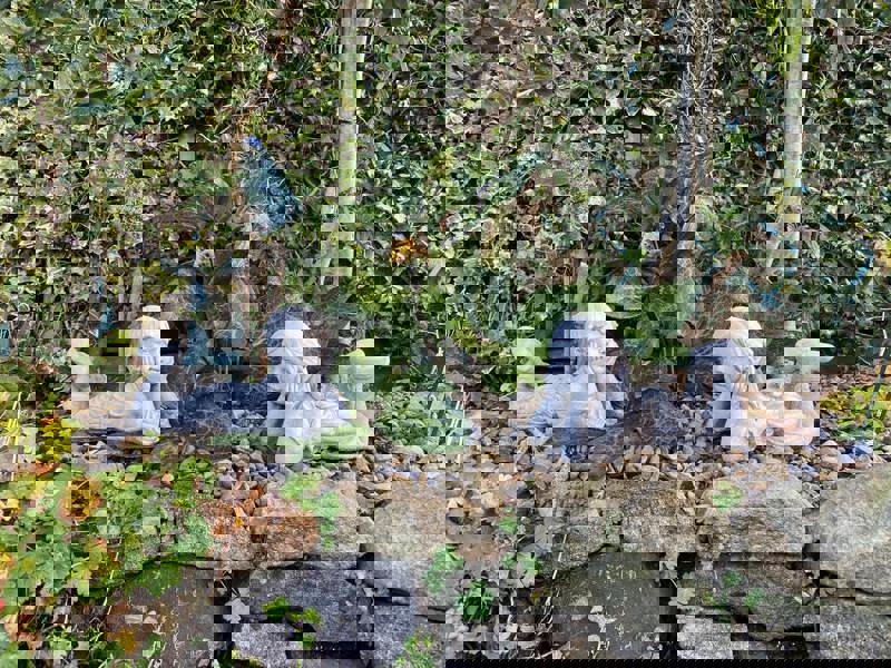 Cheerful Laying Boy and Girl Outdoor Ornament