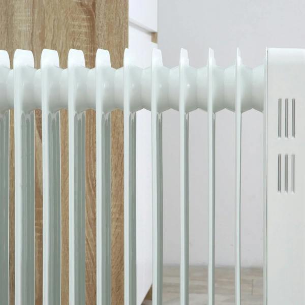 Close-up of white oil-filled radiator fins.