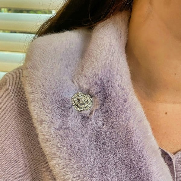 Silver brooch, rose flower design, pavé diamante detailing, layered petals, sparkling crystal embellishments, polished silver tone finish, vintage inspired decorative accessory
