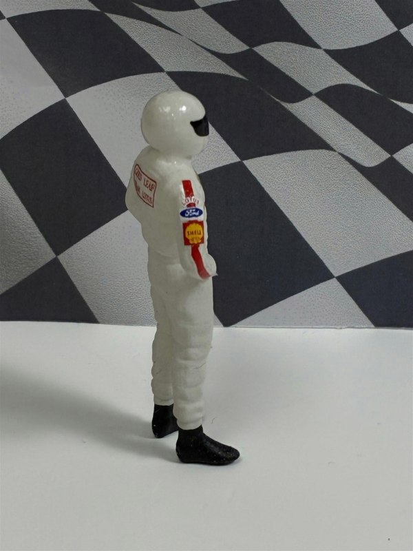 a toy astronaut in a white suit