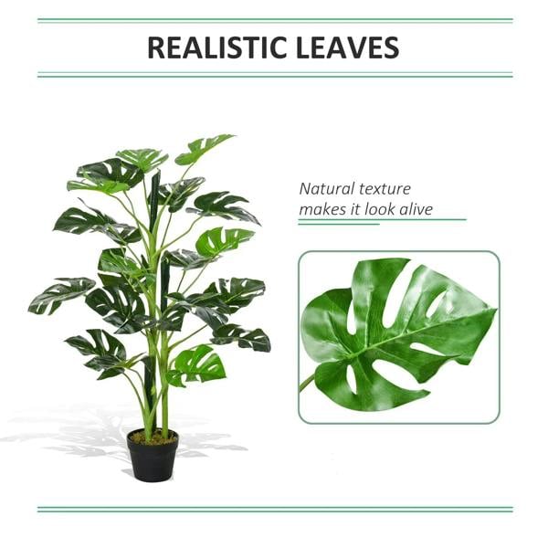 Artificial monstera leaves with realistic texture in a black nursery pot