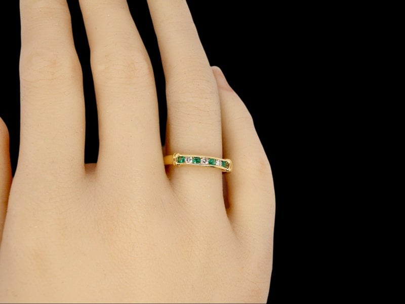 Vintage Tom An 18 carat gold Emerald and Diamond Eternity ring