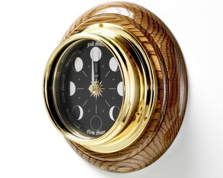 Prestige Brass Moon Phase Clock With a Jet Black Dial Mounted on a Solid English Dark Oak Wall Mount - TABIC CLOCKS