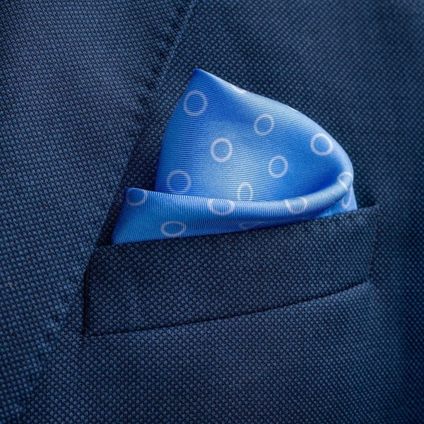 'Luna' polka dot silk pocket square in mid blue by Otway & Orford folded in top pocket