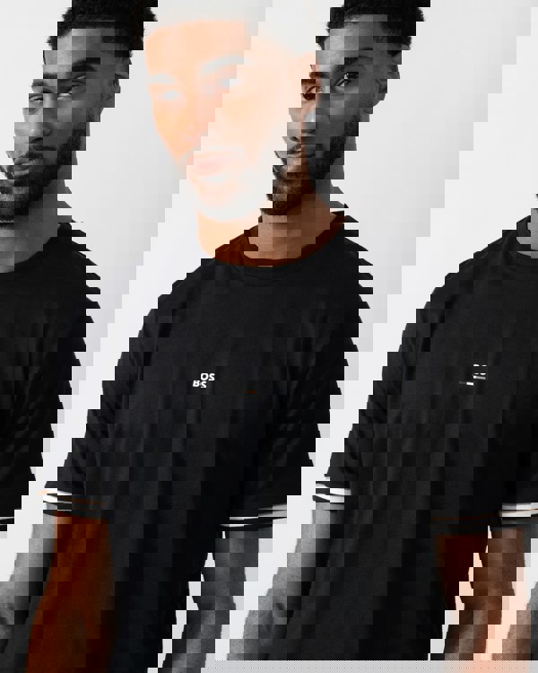 Detail shot of a Model wearing a BOSS Orange Iconic Mens Loungewear T-Shirt in Black