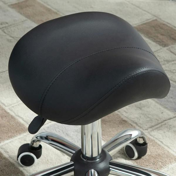 Black cushioned saddle seat stool with chrome base and four caster wheels