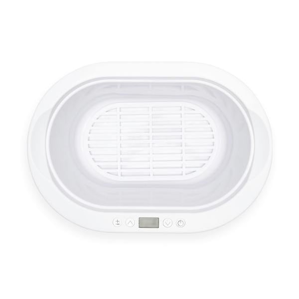 Top view of the Rio Paraffin Wax Heater, featuring a white oval shape, digital display, front control buttons, and removable inner basket—designed to enhance comfort and boost skin hydration.