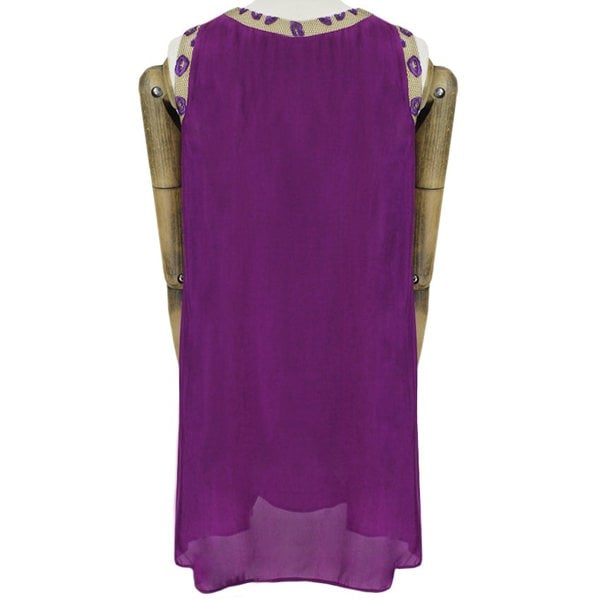 An embroidered lip and mesh edged dress by Giles