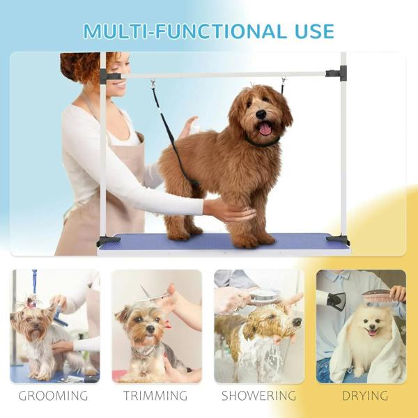 Pet grooming table in use with blue rubber top, hanging straps, and adjustable frame