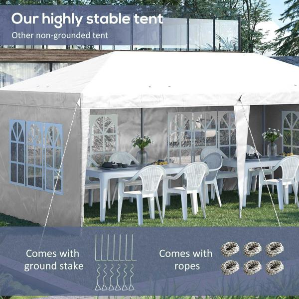 White pop-up gazebo with sidewalls and window panels, set up for outdoor seating