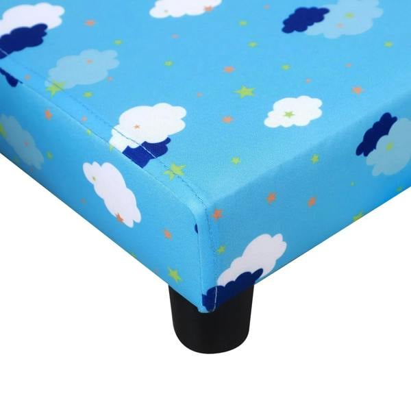 Blue upholstered corner of toddler armchair with cloud-and-star pattern and dark legs