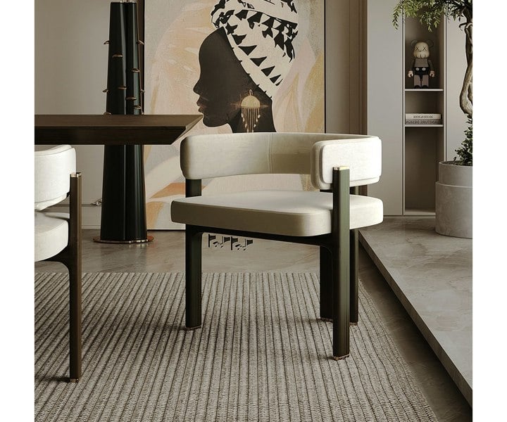 Contemporary Karl dining chair with luxurious fabric and brass accents.