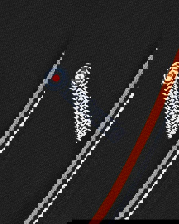 Lambretta Mens Twin Tipped Pique Classic Casual Smart T-Shirt, close-up of black fabric with embroidered Lambretta logo and orange striped trim.