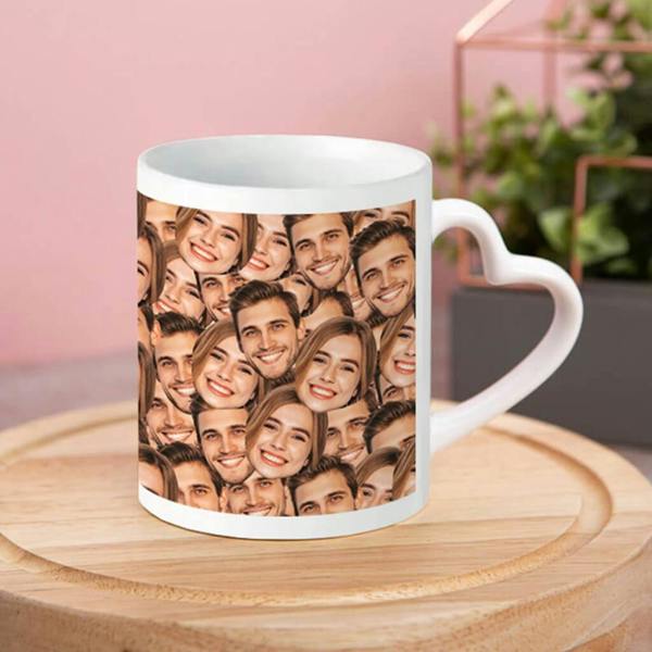 A white ceramic Personalised Photo Heart Handle Mug showing a printed collage face pattern of a smiling couple, resting on a round wooden board.