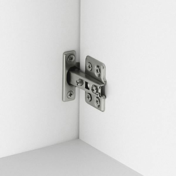 Metal hinge plate hardware inside a white under-sink cabinet
