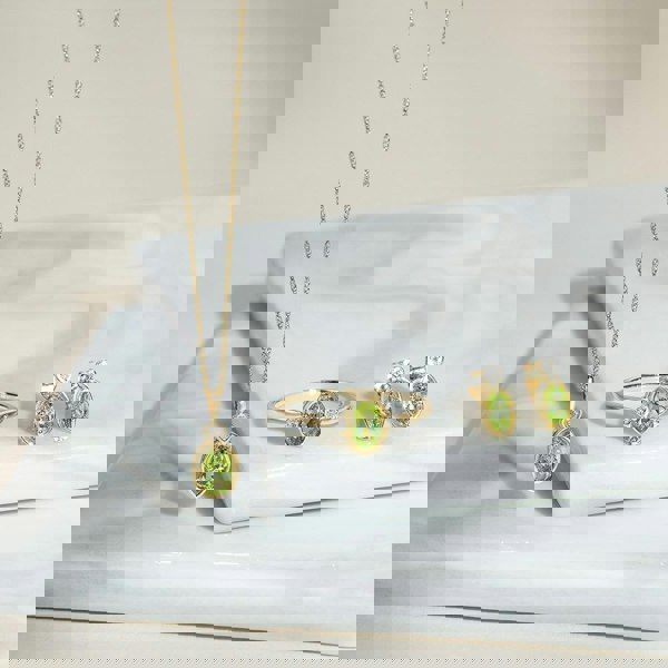 classic-oval-peridot-diamond-heart-stud-earrings-in-9ct-yellow-gold-135e1911039 Flatlay