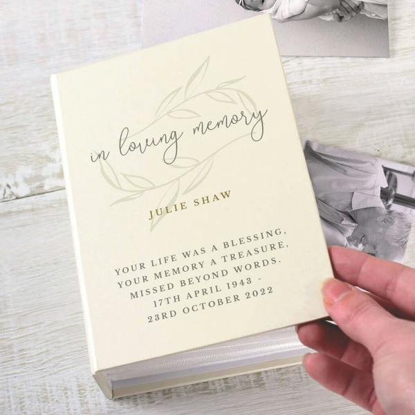 Personalised 'In Loving Memory' Photo Album in cream with olive branch motif, personalised with name and dates for a thoughtful bereavement keepsake.