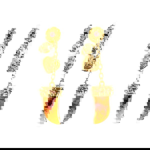 Gold earrings with amber-colored gemstones on a white background