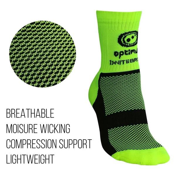 Fluro green Optimum NiteBrite cycling sock with black mesh sole beside fabric close-up, on white - Optimum