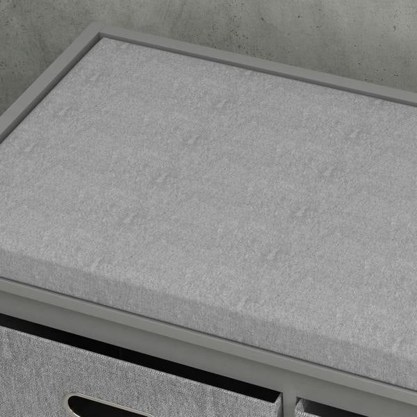 Grey padded top seat of shoe storage bench with smooth fabric surface