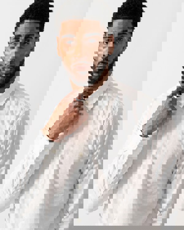 detail shot of a Model wearing HUGO Ermo Mens Slim-Fit Shirt in Stretch-Cotton Canvas in Open White