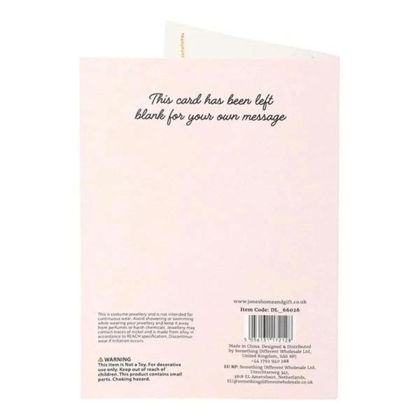 Light pink inside greeting card panel with printed message and small text at bottom