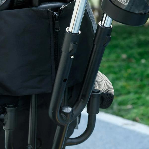 Grey kids push trike frame close-up with safety bar and footrest