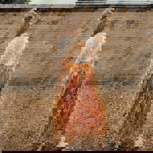 young girl wearing embroidered dress