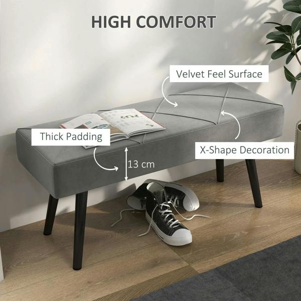 Grey upholstered bench with thick padded seat and dark steel legs