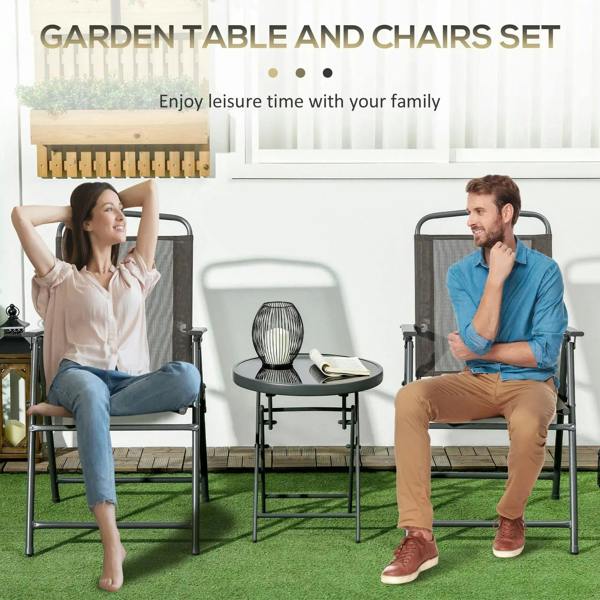 Two folding mesh armchairs and round dark table for outdoor seating