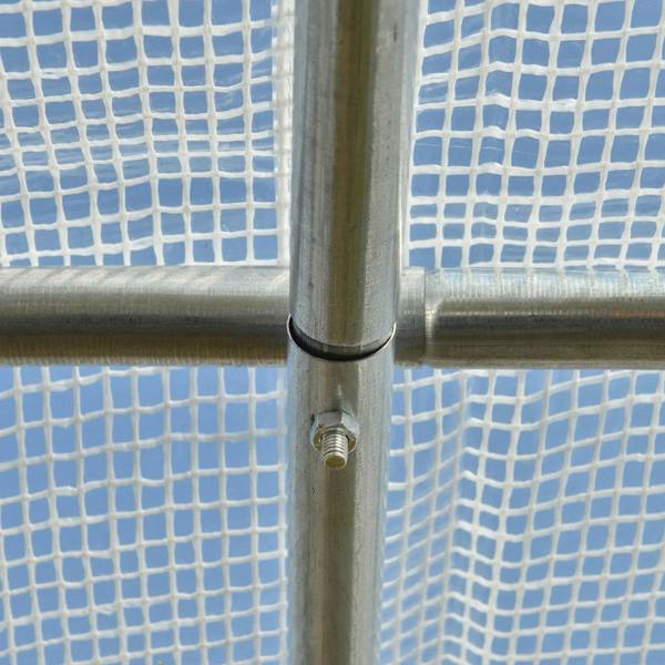 Close-up of white PE mesh cover secured to a metal greenhouse frame pole
