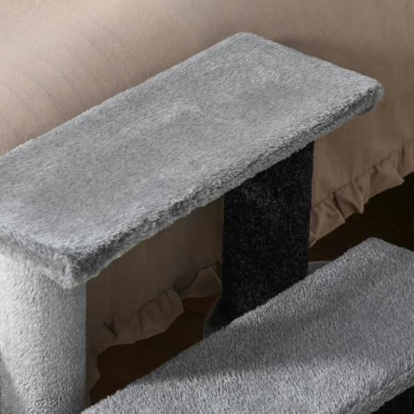 Grey plush top platform and lower step of pet stairs with scratching post, close-up